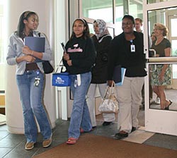 A group of student interns walks in the door at EPA.
