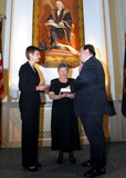 Hundreds gather in the U.S. Government Printing Office's Harding Hall for the swearing in of the nation's 25th Public Printer, Robert C. Tapella. The event took place on November 6, 2007 in Washington D.C. Nancy Erickson, Secretary of the U.S. Senate, administered the oath of office. Tapella's mother, Bernadette Tapella, is holding the Bible.
