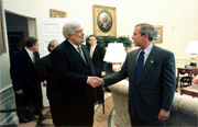 The President greets Bruce James in the Oval Office