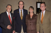 Senator Pete Domenici (right) and GPO’s Deputy Public Printer Bill Turri (left) congratulate New Mexico State Library’s Richard Akeroyd and Laurie Canepa on receiving the 2005 Federal Depository Library of the Year Award.