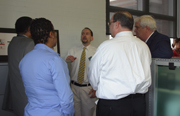 Ron Keeney highlights GPO's security printing and web services to agency customers as Public Printer James and fellow GPOers listen in.