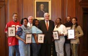 Public Printer James recognizes GPO bindery section employees who were photographed by the press while working on the Budget of the United States Government, Fiscal Year 2007.