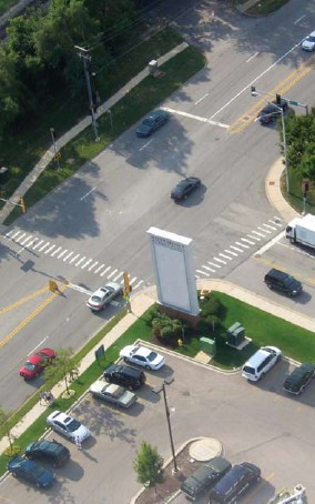 Aerial photograph of a well-marked signalized intersection treated with cross walks.