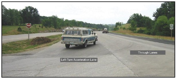 Photo of a vehicle turning into a left turn acceleration lane.