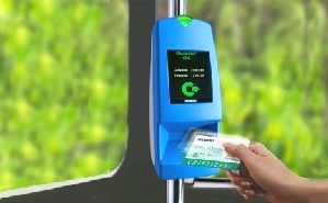 Passenger boarding a bus using a Smart Card for payment.