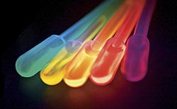 Photo of five testubes, each glowing a different bright color.
