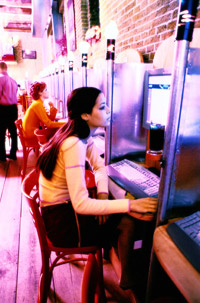 Woman at internet cafe