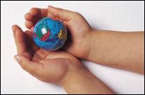 hands holding a little globe