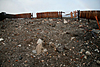 The wooden fence of the overlook itself was bombarded by rocks. Nearly every rock on the surface in this photo was deposited by the explosion.