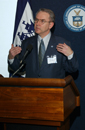 Brigadier General David L. Johnson, USAF (Ret.) Asstant Administrator National Weather Service speaks  at podium about disaster prevention 