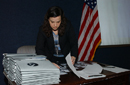 NOAA staff  member preparing briefing materials