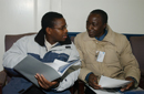 Two participants going through briefing materials