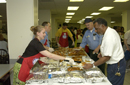 NOAA Staff and volunteers serve up food for the fish fry 