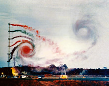 Aircraft wake vortex testing - colored smoke is emitted from test equipment to show air turbulence.