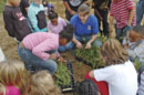 Service biologist Carolyn Kolstad, director of the Chesapeake Bay Field Office’s Schoolyard Habitat program explains the intricacies of wetland plant plugs. Credit: Lavonda Walton/USFWS