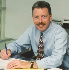 Photograph of Don Welsh, EPA Region 3 Administrator, seated at his desk