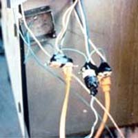 These cords are improperly wired directly to the electrical circuit, are not protected by a GFCI, and are two-wire cords that are not grounded and not rated for hard- or extra-hard service.