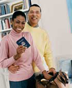 A couple is holding a passport.