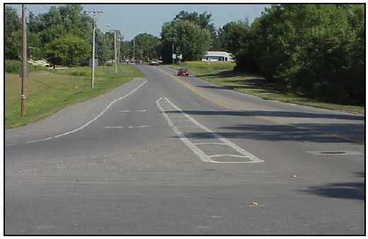 Photograph of an intersection with an offset right turn lane.