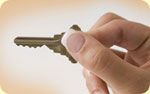 A woman holding a key.