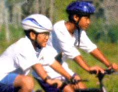 {Two boys on a bike image}