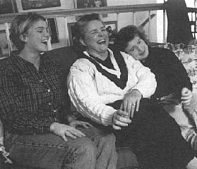 {Janie with daughters on sofa image}
