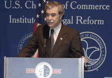 Gutierrez at lectern. Click for larger image.