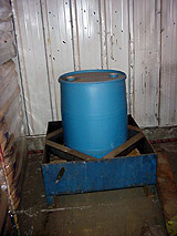 Storage of 55 gallon drum in pan to contain leaks