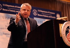 Sullivan gestures from the podium during remarks.