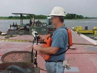 Shipyard Competent Person (SCP) checking atmosphere prior to entry