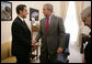 President George W. Bush drops by a meeting between National Security Advisor Stephen Hadley and France's Minister of the Interior and Regional Development Nicolas Sarkozy at the White House Tuesday, Sept. 12, 2006. White House photo by Kimberlee Hewitt