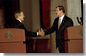 President George W. Bush reaches for Mexico's President Vicente Fox during a joint press conference at the Palacio de Gobierno in Monterey, Mexico, Friday, March 22. "The relationship between the United States and Mexico is very strong, is very important, and it's growing stronger every day," said President Bush in his remarks. White House photo by Eric Draper.