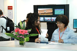 Interns Oversee The Asia Now Appointments At A Trade Event.