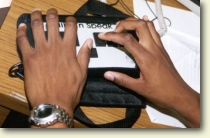 photo of hands using the Braille-n-speak notetaker