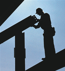 Image of a man working on steel beems up in the air