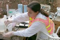 USGS scientist collecting water-quality samples for the investigation of the natural restoration of the wastewater plume on Cape Cod, Massachusetts.