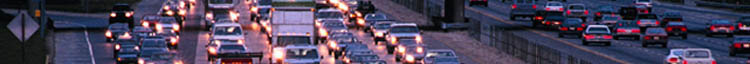 time lapse photo of traffic traveling down and exiting from a freeway at night