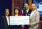 Secretary Chao presents a facsimile National Emergency Grant check to Washington, D.C., Mayor Anthony A. Williams.