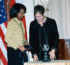 Secretary Rice presents 2005 Award for Corporate Excellence to small-medium enterprise winner Lapa Rios Co-Founder Karen G. Lewis. State Department photo.