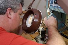 ULA technician Bob Arp solders the connector for mission STS-122.