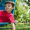 Photo of child relaxing outdoors.