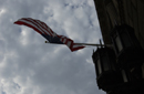 Flag waving atop main entrance of Commerce Building