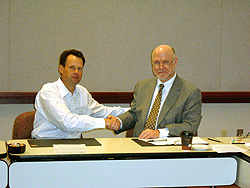 MSHA Acting Assistant Secretary David G. Dye, right, and Michael A. Gardner, Executive Director, Gypsum Association, left, sign agreement to partner with organizations to prevent workplace injuries and illnesses.