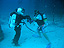 A NEEMO aquanaut dives using a U.S. Navy EX-14 suit.