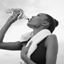 Photo of a woman drinking bottled water