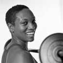 Photo of a woman lifting free weights