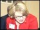 Secretary Spellings watches a student conducting an experiment in forensics class at Ramsay High School in Birmingham, Alabama.