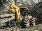 John Deere Skidder dragging logs