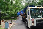 recycling truck picking up a bin