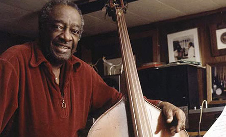 Milt Hinton posed with his acoustic bass